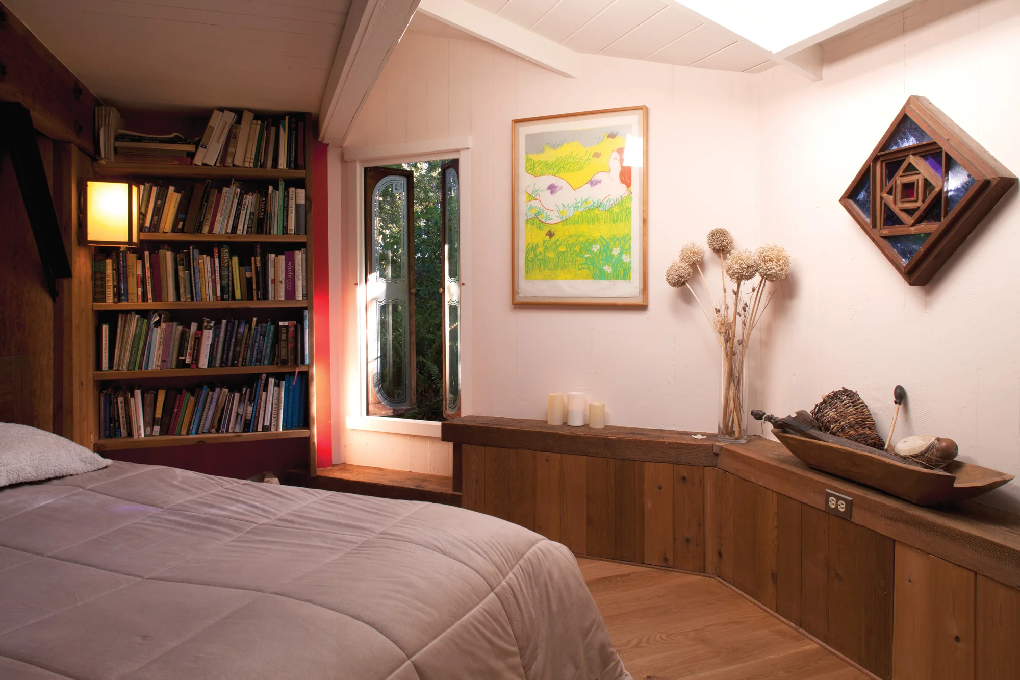 One of three first-floor bedrooms has a portion of the Van der Ryn Architecture and ecology library.