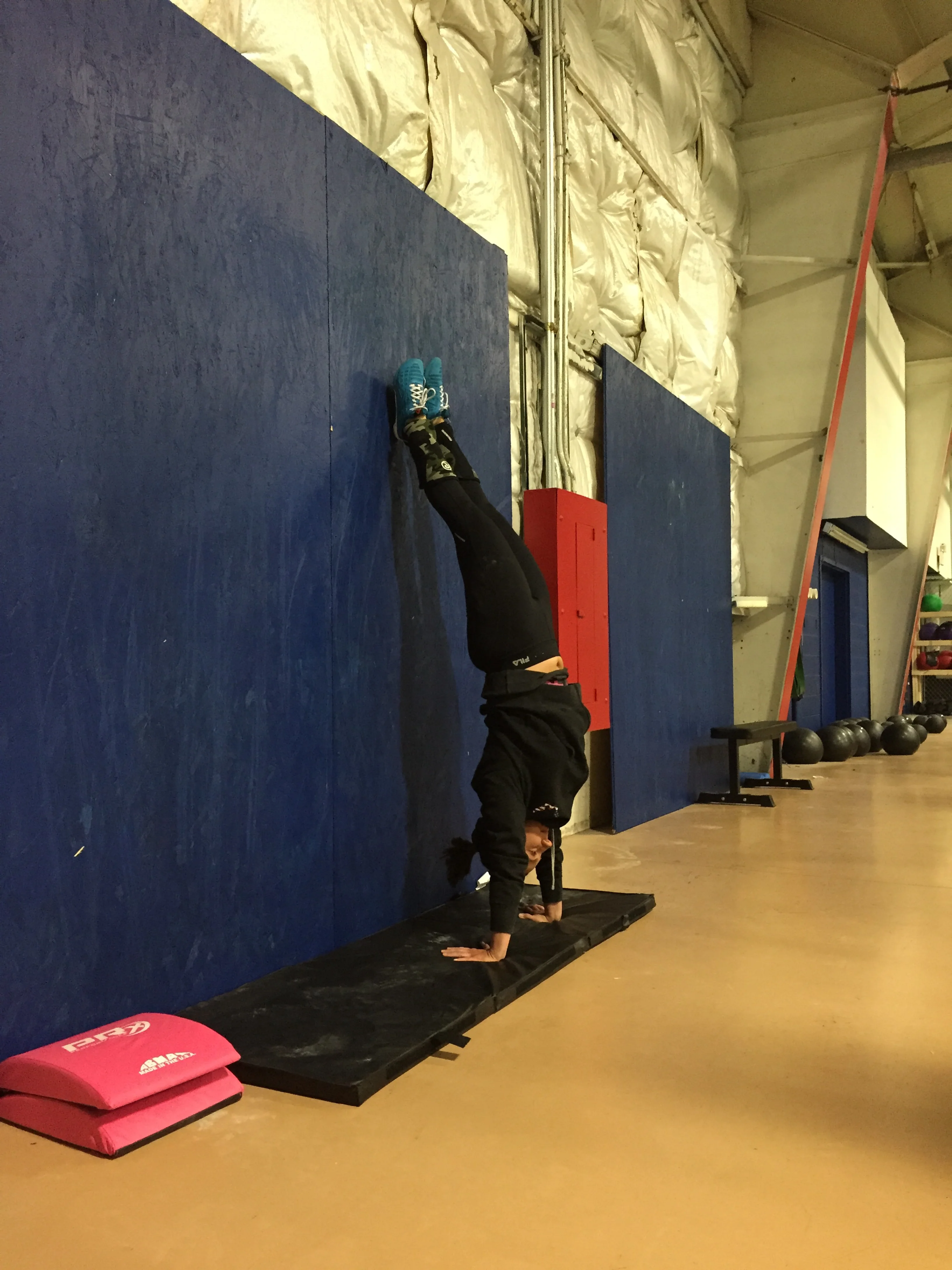 Kristen working on her handstand position.