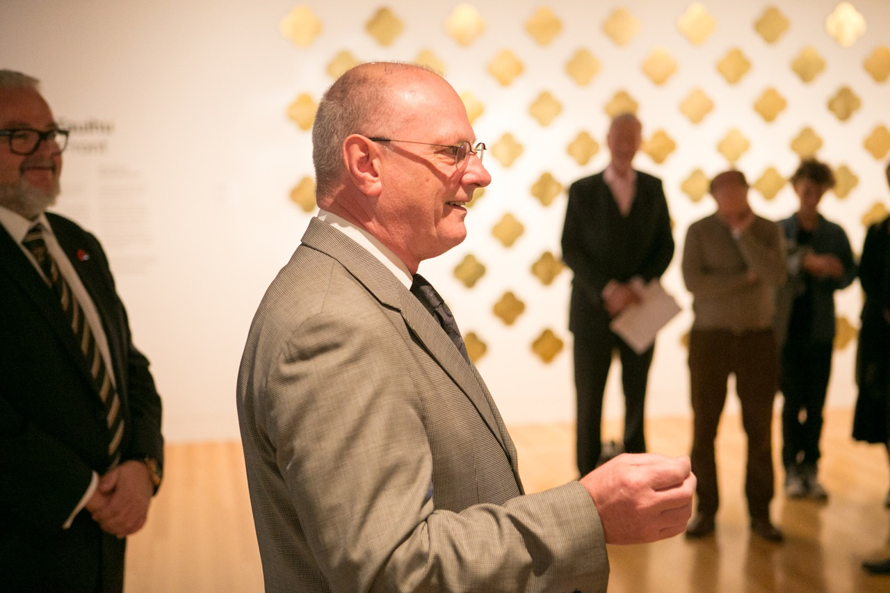 Brian Sweeney addresses the gathering and speaks on behalf of Max Gimblett ONZM. Dale Bailey, Director Collections, Research and Learning looks on. Photography by Michael Hall copyright Te Papa Tongarewa.