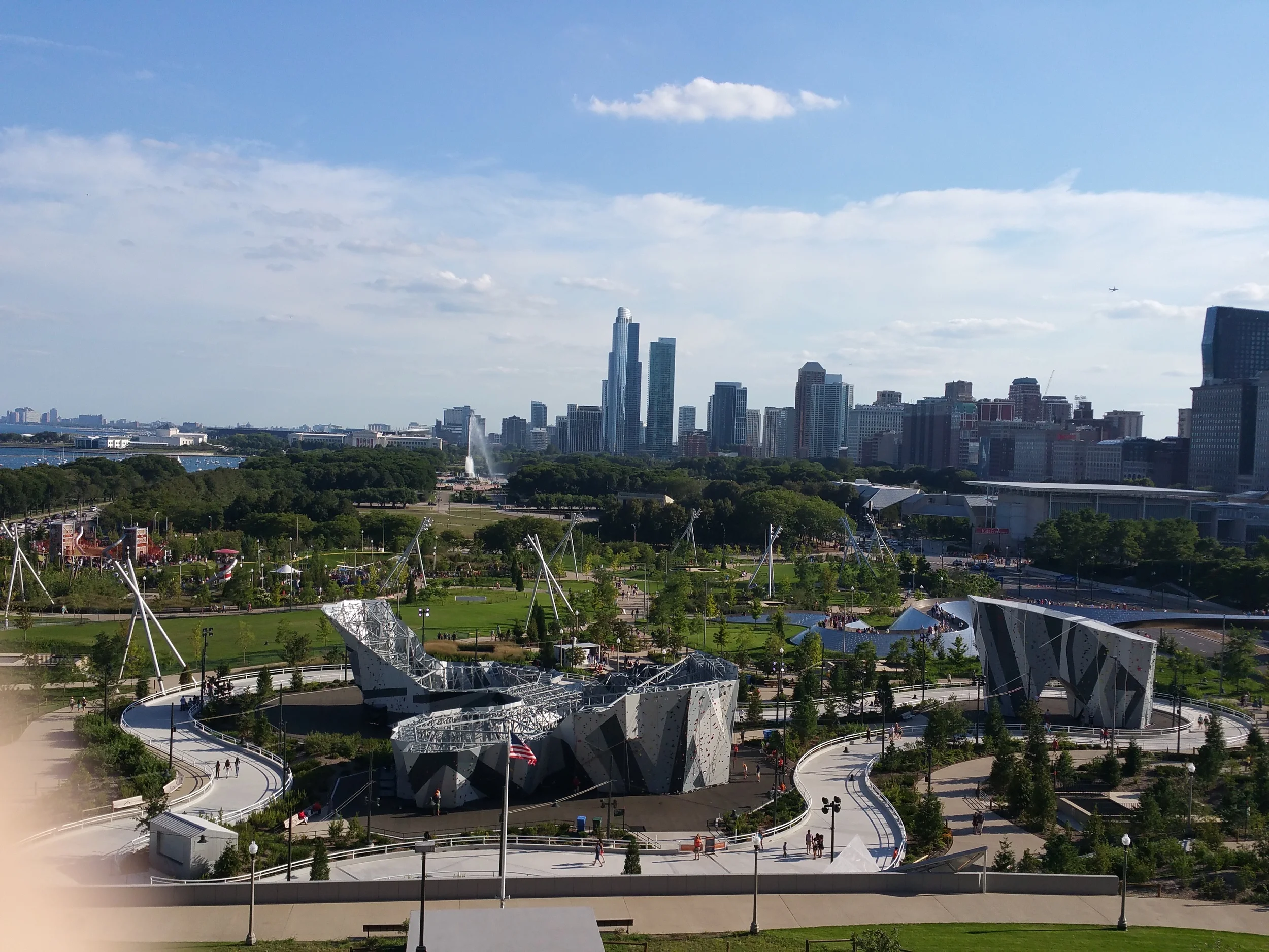 Millennium Park from the Northeast corner looking south with a view of Maggie Daley Park, Buckingham Fountain, the Modern Wing of the Art Institute, the Field Museum of Natural History, and the Shedd Aquarium.