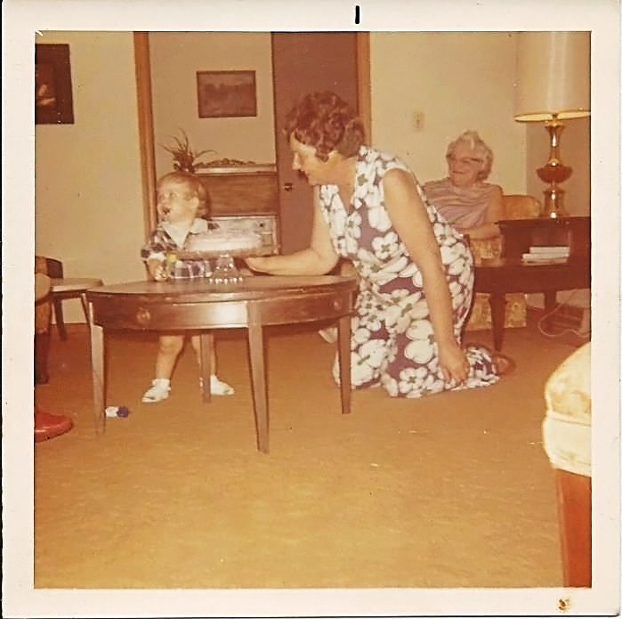 My mom(grandmother) and me. I'm guessing it was my first birthday. I believe in the back that is "Aunt" May. She lived to be 103. My mom passed away about 15 years ago.
