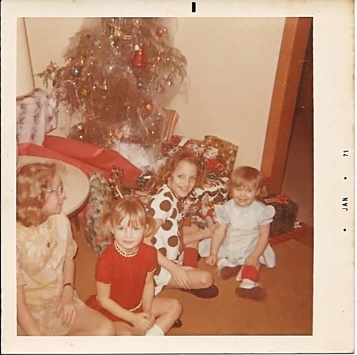 My cousins, Terri, Rhonda, Debbie and Me (2yr old) Notice the saddest, ugliest Christmas tree in the history of EVER! It looks like it has cobwebs all over it! 