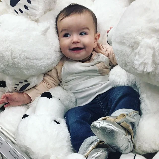 Sometimes it's a good idea to chuck your kid into a huge bin of stuffed animals. They just might like it.