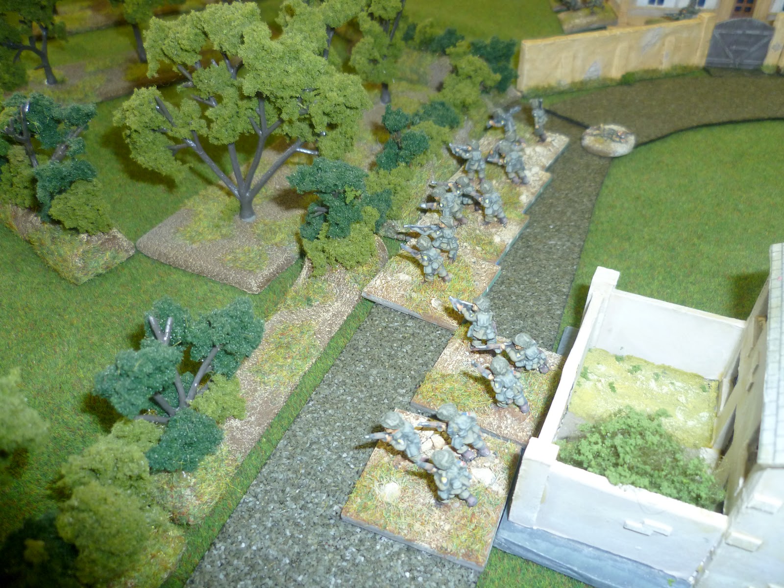 Lt Turnbull's defenders in the centre of Neuville covering the orchards and fields to their front