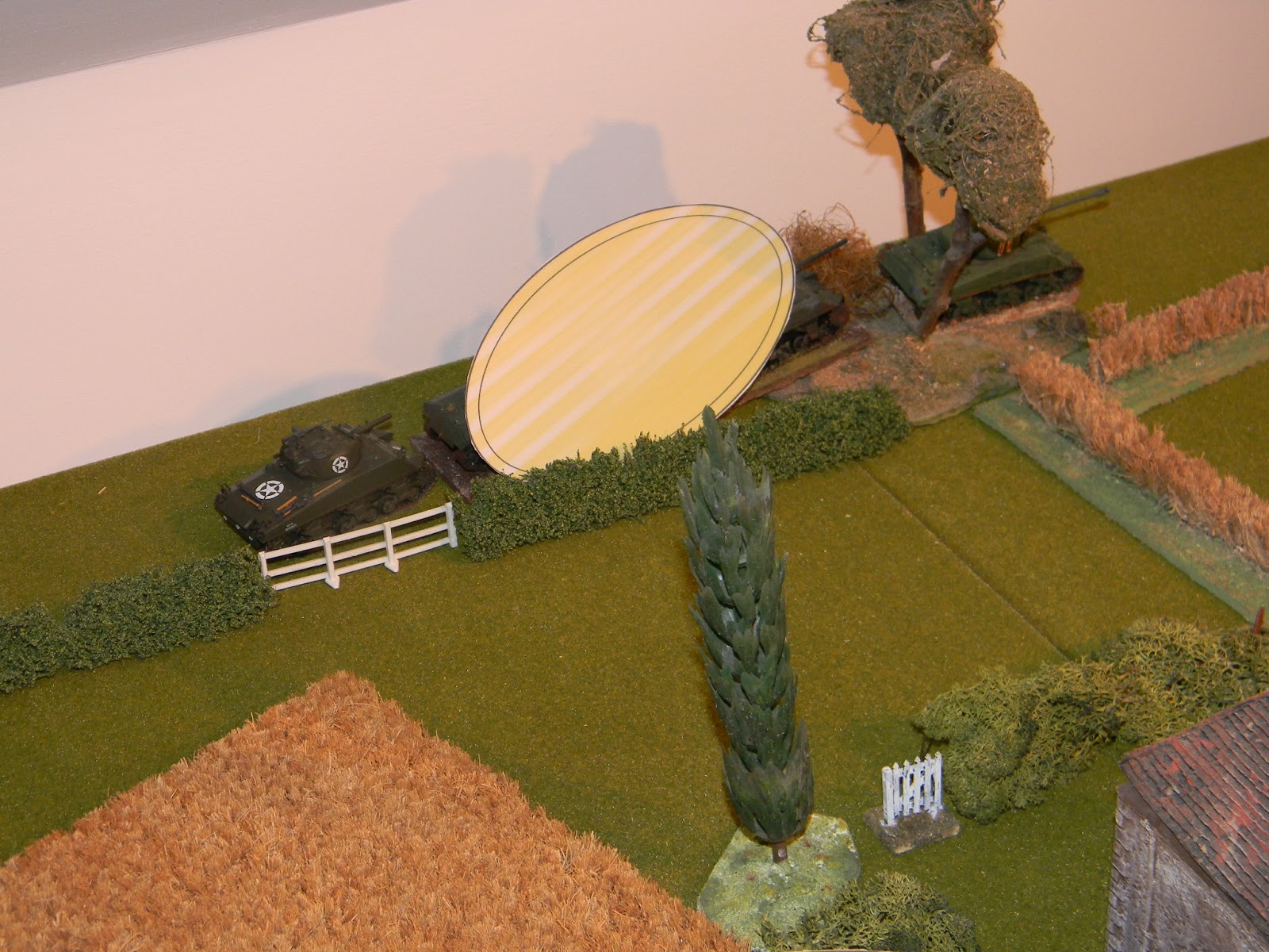 Lt. Carlyle's troop of Shermans head around the outskirts undetected by the German defenders
