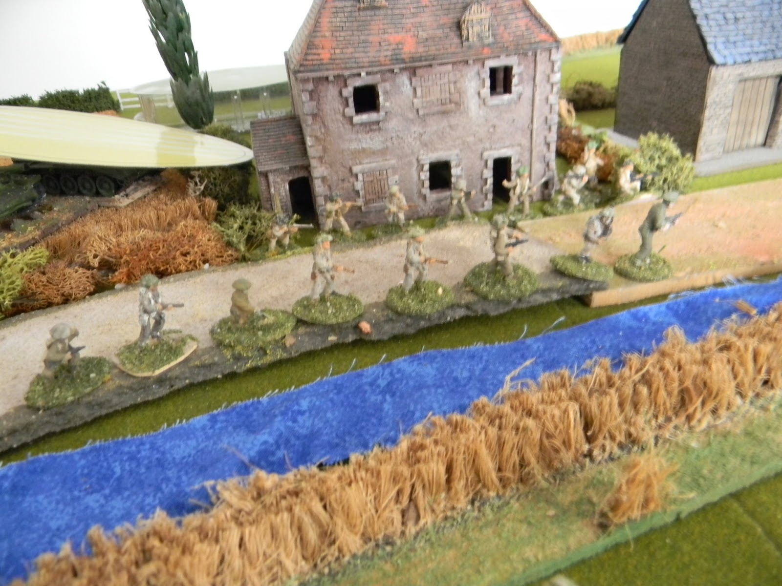 British infantry rush up the road.