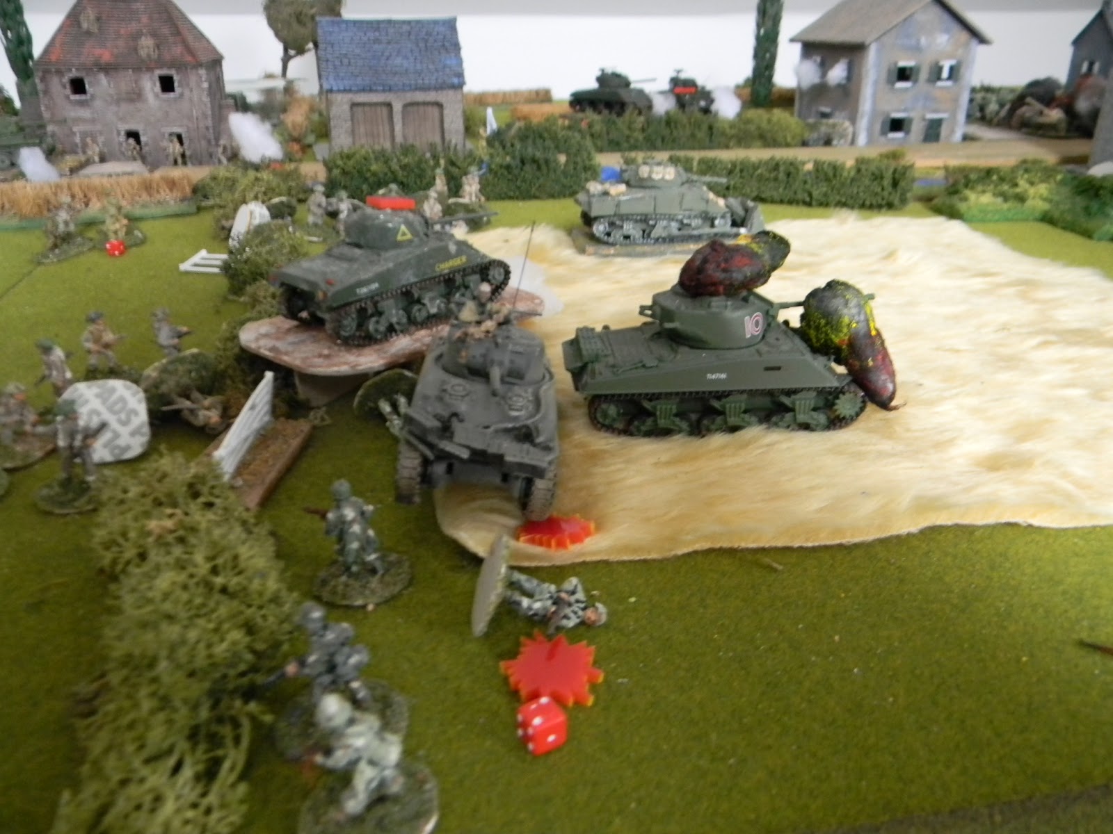 As No.1 Troop by-pass their commander's burning Firefly.