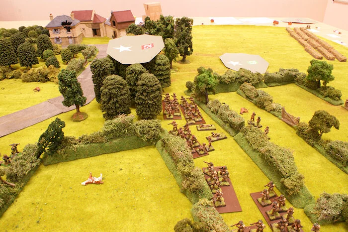 While British and German sections are exchanging fire from hedgerow to hedgerow, a Blind reaches the forest.