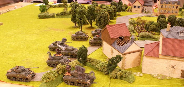 A Sherman of the 1st platoon is destroyed by the anti tank team.