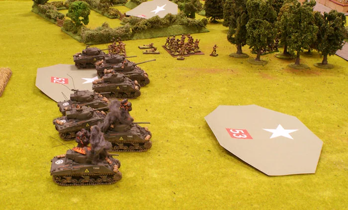 The Pak40 hidden in the orchard in the centre opens fire and manages to destroy two Shermans including Cpt. Beaumont’s one before another Blind moves further...