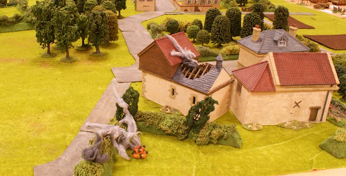 They fire a salvo of HE shells at the farm and the nearby hedgerows.