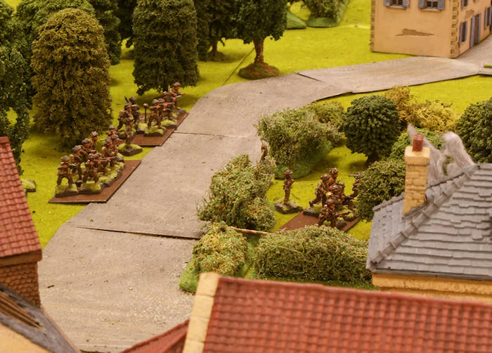 While the 1st platoon stays in the wood, Lt. Oiksworth and the last section of his platoon crosses the road to reach the orchard.