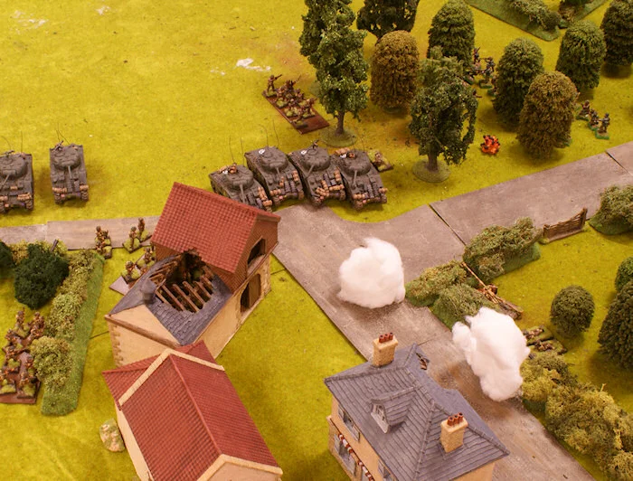 One of the 1st platoon’s sections manages to withdraw with Lt. Roundwood whilst the other is wiped out by the assault of the Waffen-SS.