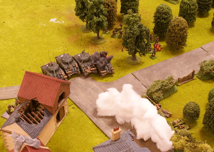 The Panzer Grenadiers of zug 1 under command of Obersturmfürher Festem-Schritt attack the Shermans with panzerfausts but only one is destroyed.