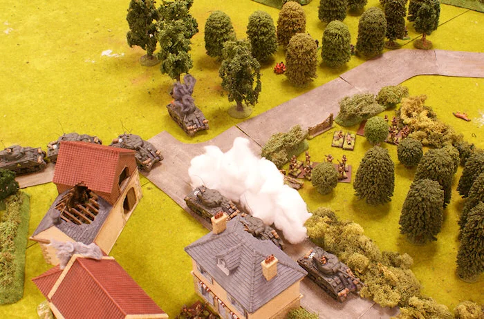 After dispersing the zug 1 with machine gun fire, the tanks of the 1st platoon moves behind the smoke curtain.