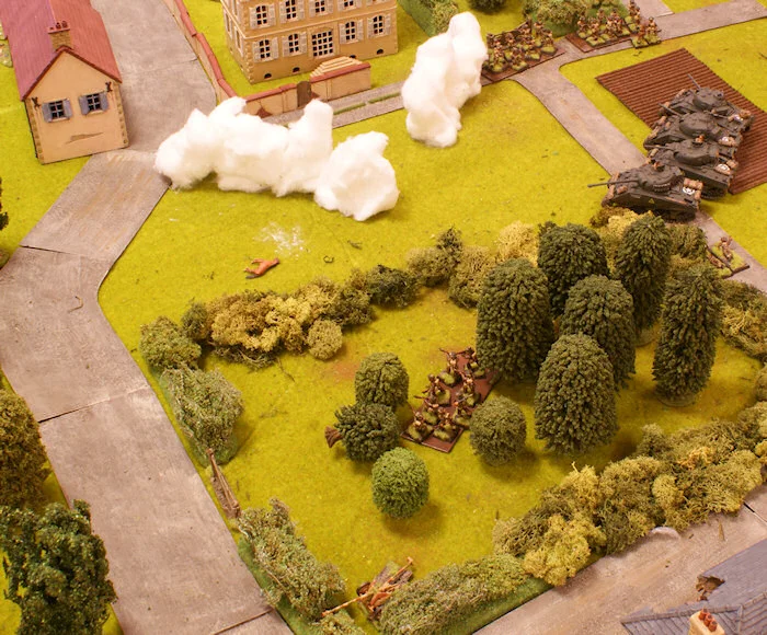 With the farm buildings and the orchard under control, the 3rd platoon moves towards the Chateau.