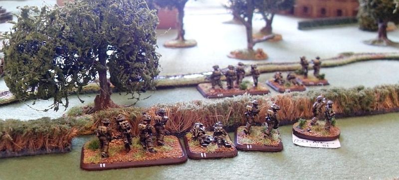  Canadian infantry cross the hedge line and start to advance 