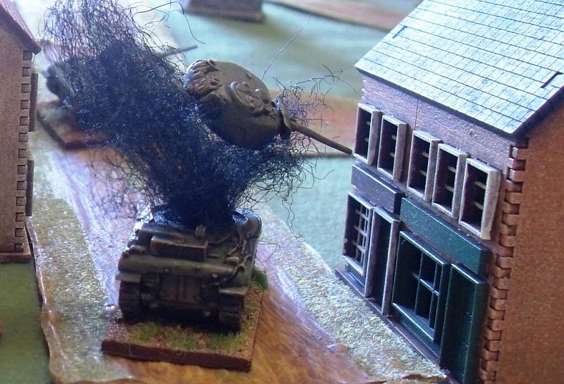  Action Shot: turret blown off the Sherman V by a PanzerFaust from&nbsp;the building next to it 