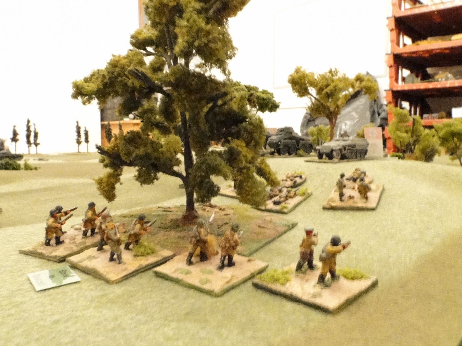 Russian infantry reach the edge of the wood as the Germans top the hill.