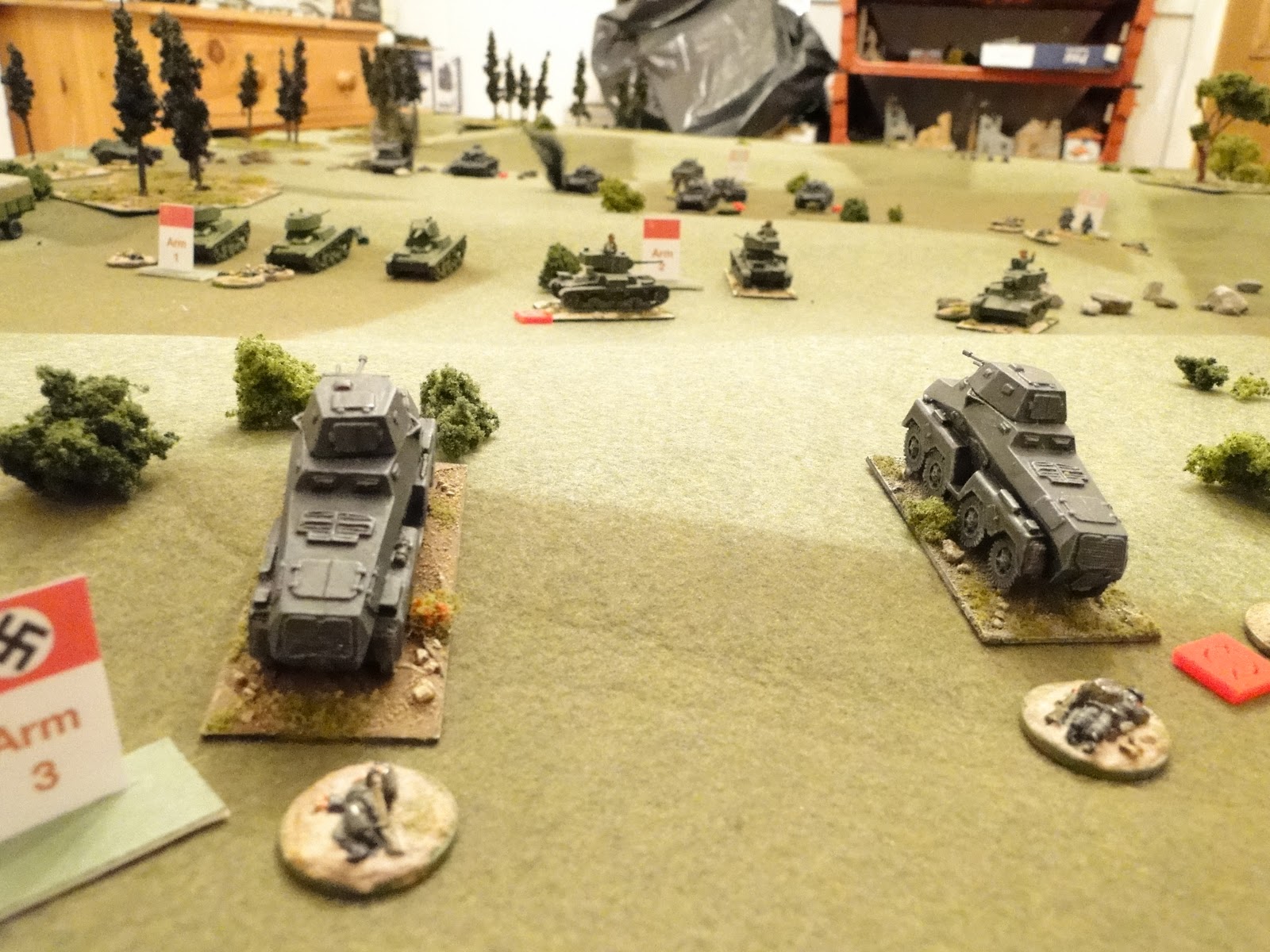 German recce turns back to fire on the rear of the Russian tanks.
