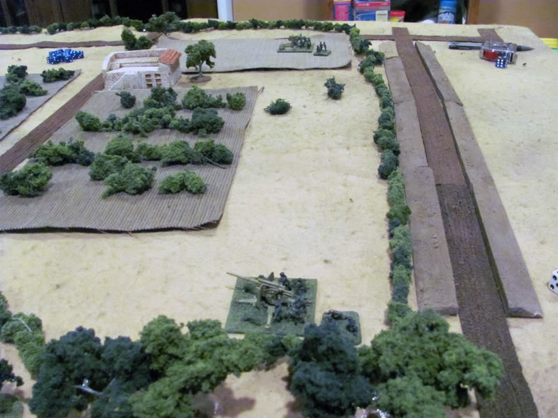 Two German FlaK 36 88mm dual purpose guns reveal their positions in the vineyards and open fire on the Shermans