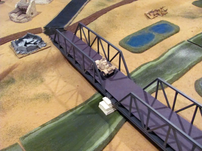 Daimler armoured cars dash across the Ponte Primosole in an attempt to outflank the 88s in the vineyard