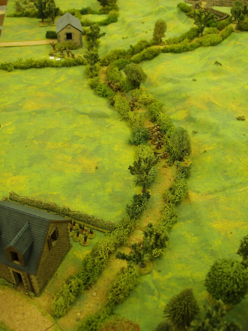 The Germans in hard cover have the advantage. A rash British move for the building in the open is punished.