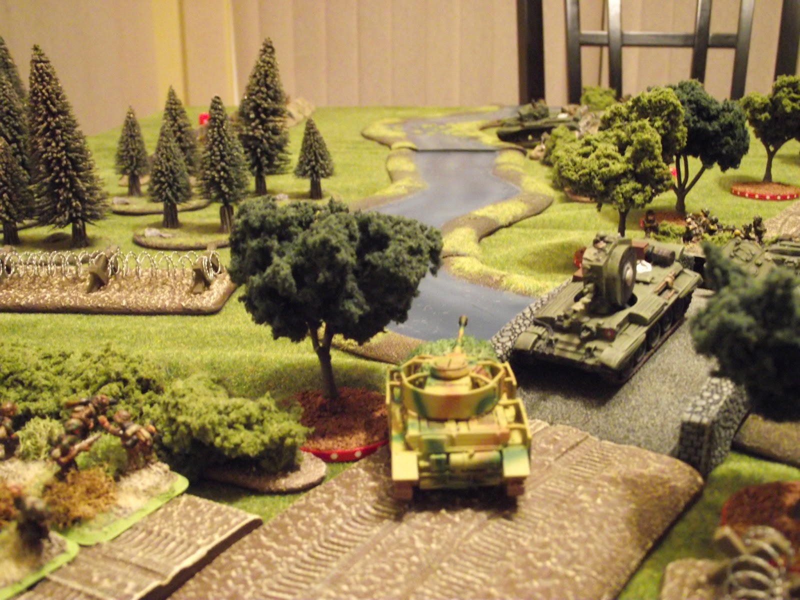  The Panzer IV survives the Challenger's shooting and rushes to the bridge to get a flank shot on the remaining Cromwell trying to cross the ford. 