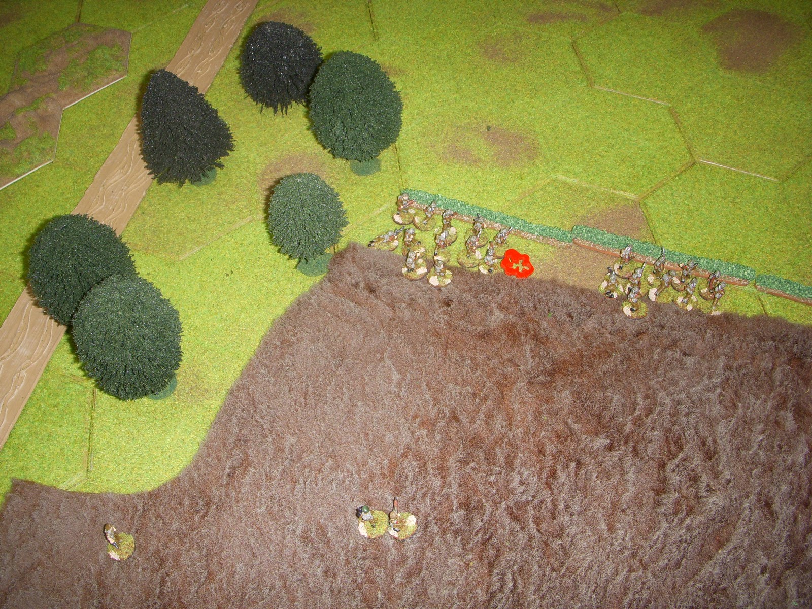  They start taking casualties from the MG in the stone farmhouse on the hill. 