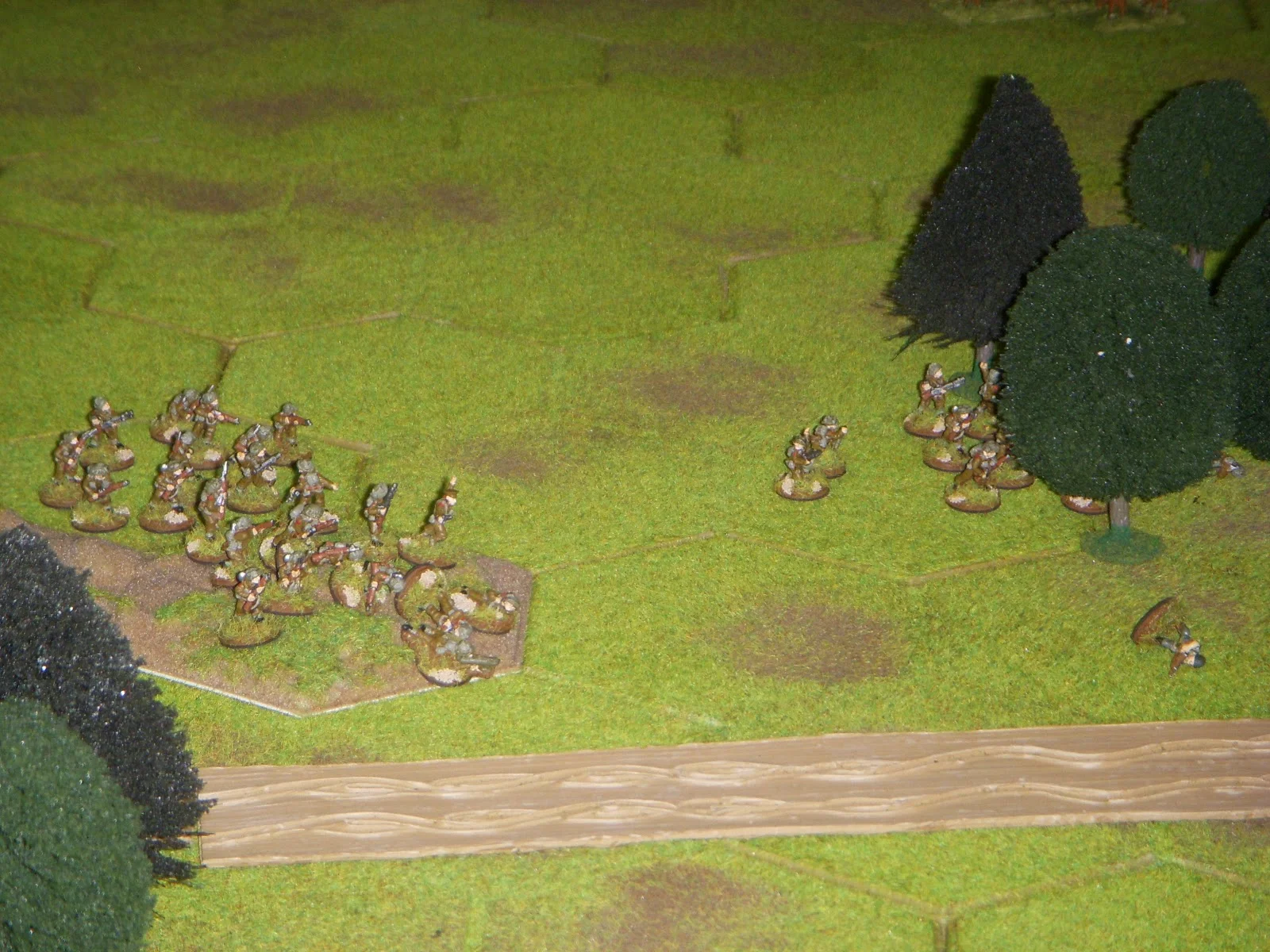 Meanwhile, 2nd Platoon has advanced on the left flank and entered the woods after flushing out the lone German squad