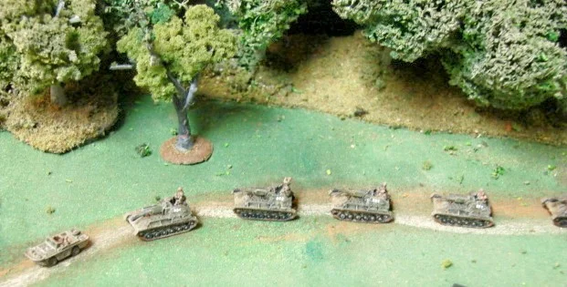 SU-76s SPGs attempting to catch up with the lead Red Army columns took a short cut that came out on the east side of the woods. Jeep in the lead with battery commander.