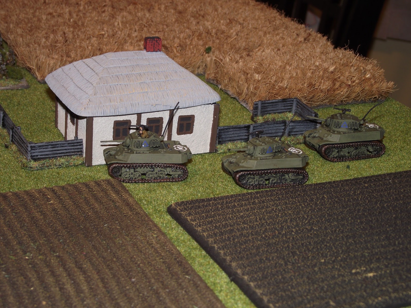   British recce tanks checking out the outer farm houses.  