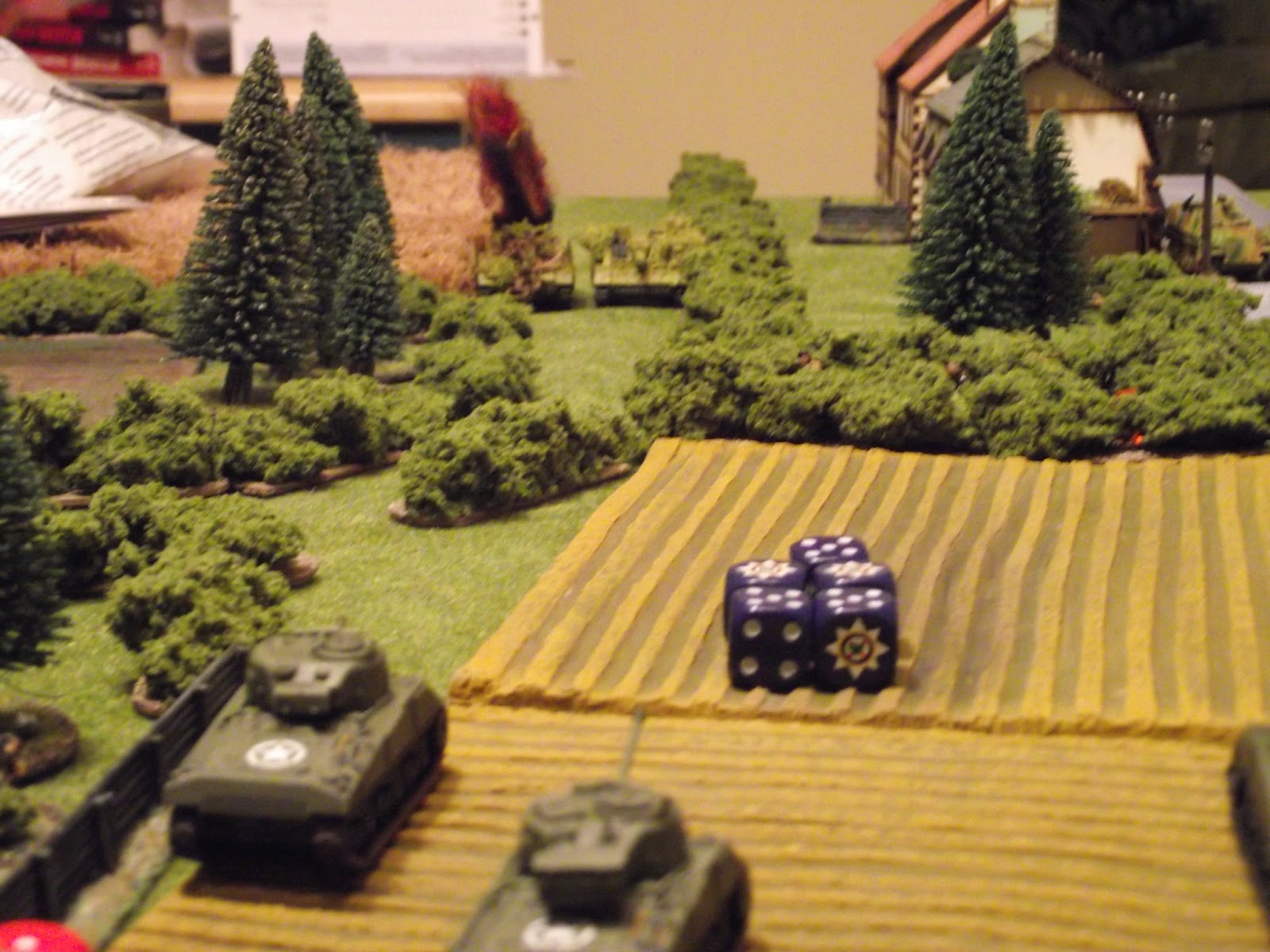   The StuG platoon manages to hit the Sherman on the right twice, but only managed to do some minor engine damage. The return fire from that same Sherman blew up the StuG on the left with a 5-0 score. The Firefly managed to knock out the 10.5cm StuG'