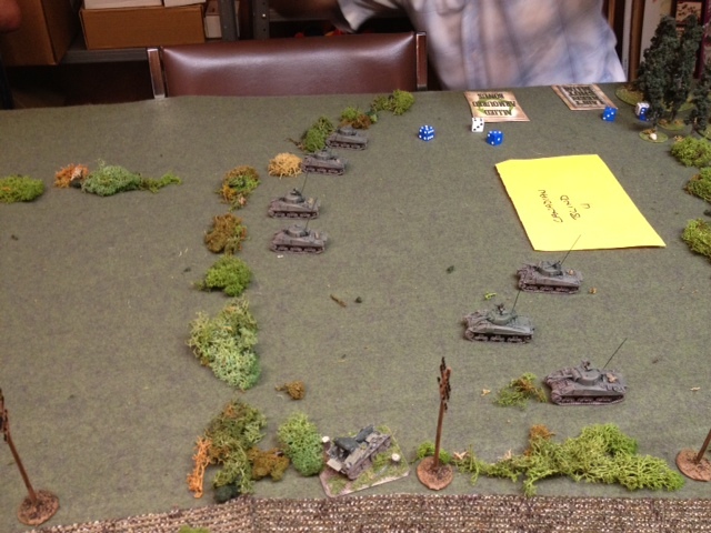 Allied armour advances on the right.