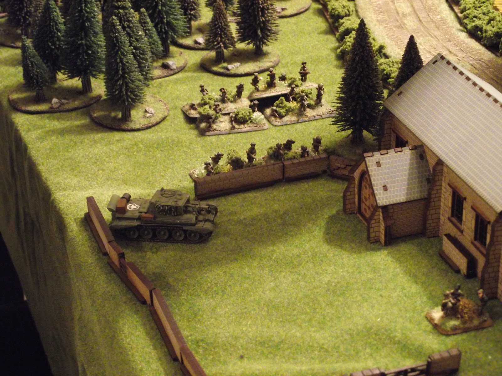  Cromwell breaks down the wall and gets ready to pound the SS infantry who have taken shelter inside. 