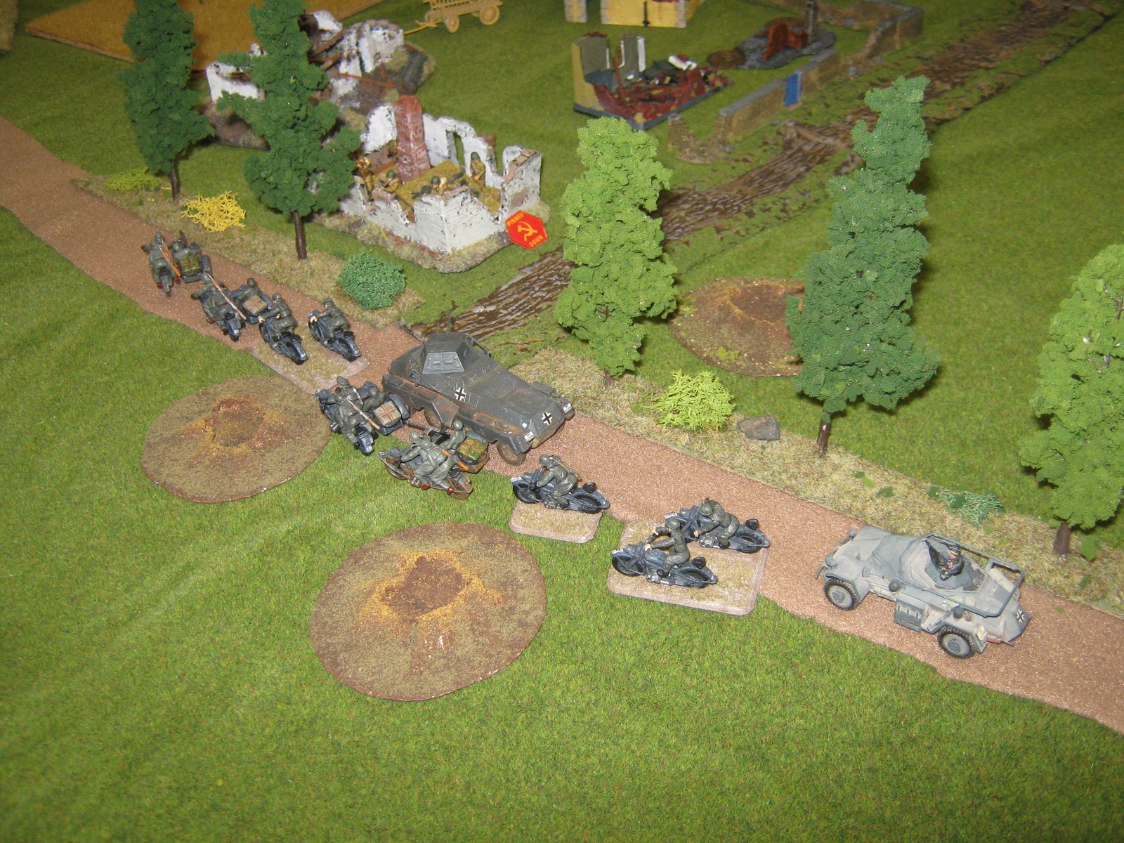 A few ill-equipped men stops the mighty German army. Notice the small armoured car, a PSW 223.