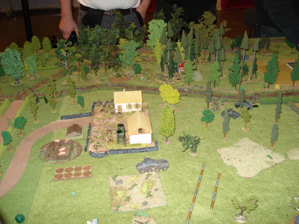 The farm, just before it really kicks off. The German armoured car has shot at the Russian, causing it to lose actions next turn and damaging its gun sight, as indicated by the markers.
