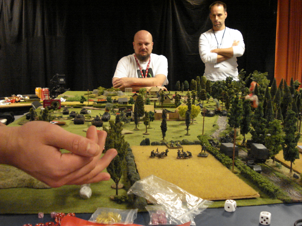The Soviet commander, Bohm (standing) and his trusty Commissar Roos (seated). The hand belongs to German player, Fredrik.