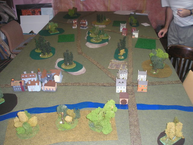 The battlefield. Couchy-end-bois is the small village at bottom right of the picture. The Germans held this village and the woods and two hills just to the left of the road that runs the length of the right table edge. The French armour attacked through St. Pierre-les-lapins at top left of table edge, while French infantry entered the woods at center left of the table.