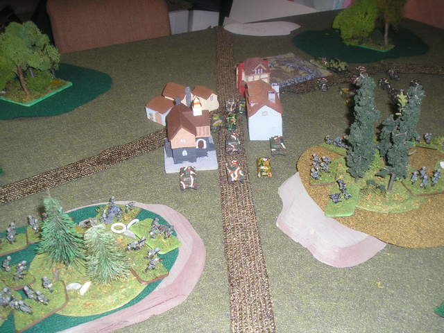 French Renault tanks move through St. Pierre-les-lapins and engage German platoons on the hills above.