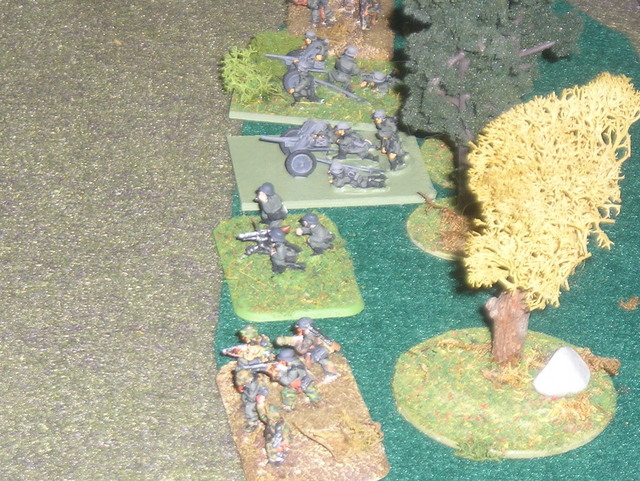 The German 2nd platoon holds the treeline against L'Huter's force. Eventually it would be drawn off by Harnadek to reinforce the German right. Infantry from my collection on the brownish bases.