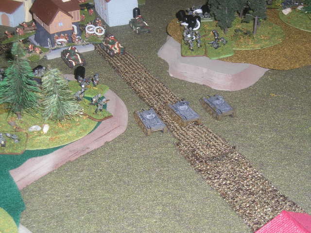 German armour come in the nick of time. A turn later, a pair of German SP AT guns appeared and began firing into the flank of the surviving Soumas.