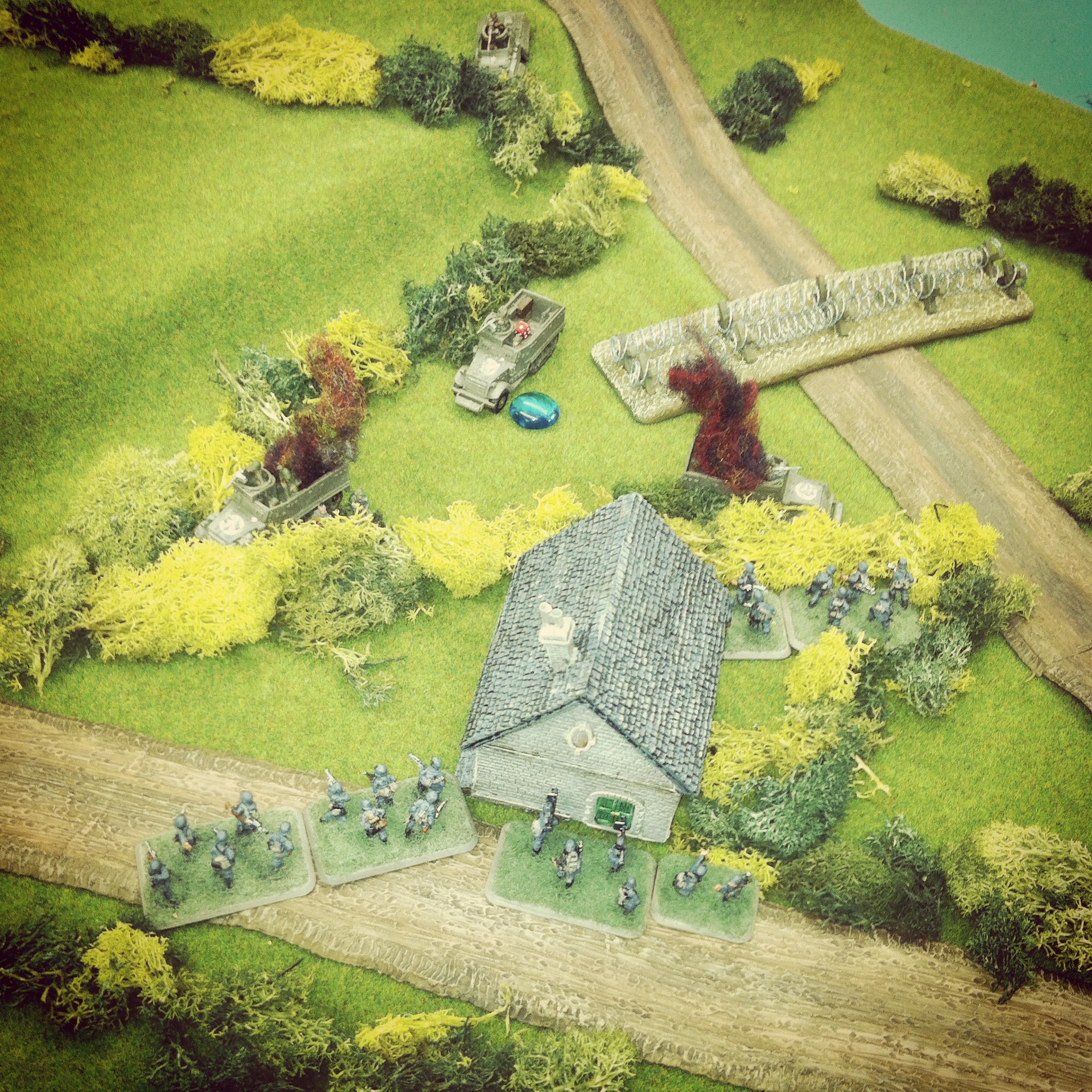 Fire from German Panzerfausts destroy two half tracks and their passengers