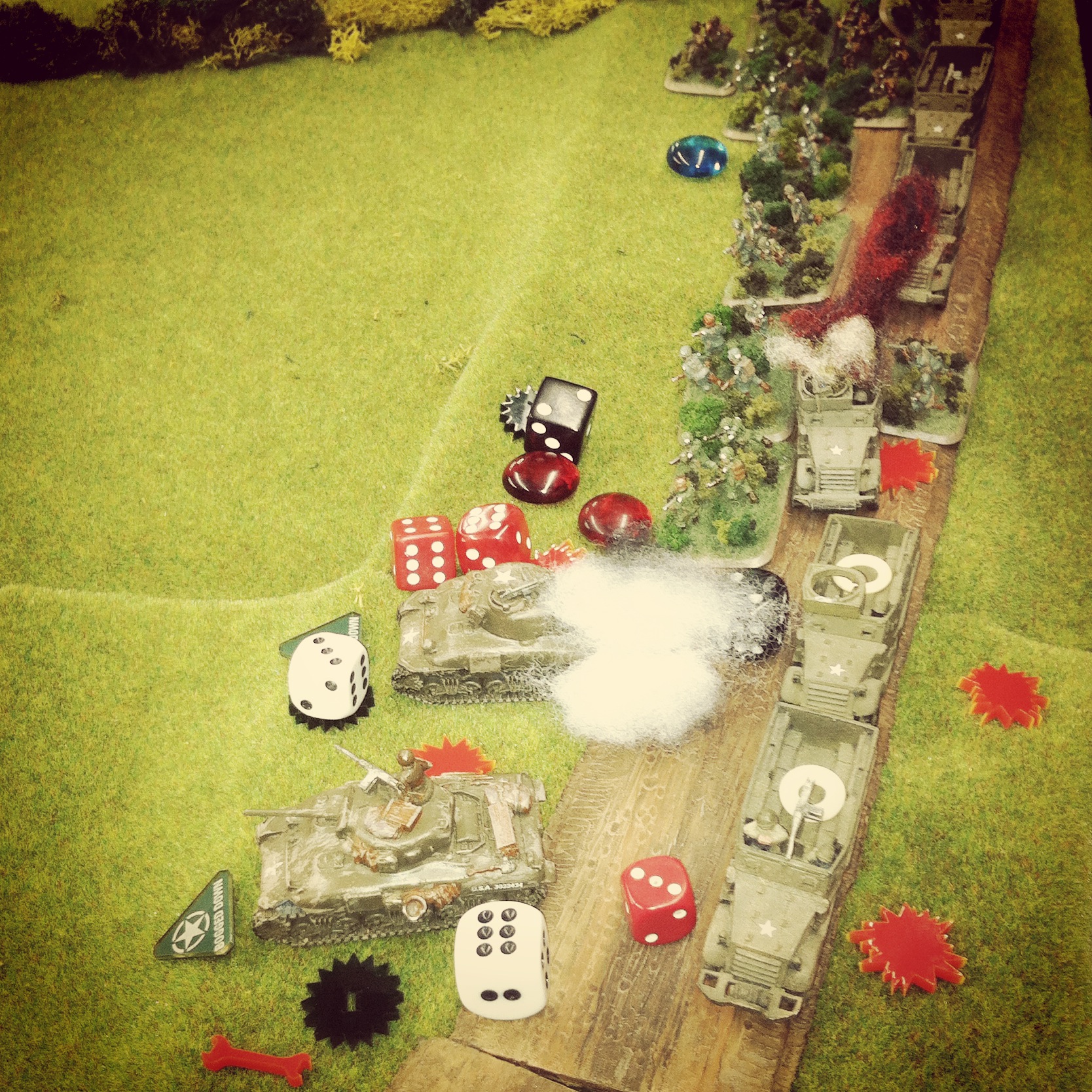 German 105mm artillery rains in from off the table wreaking havoc on the US column