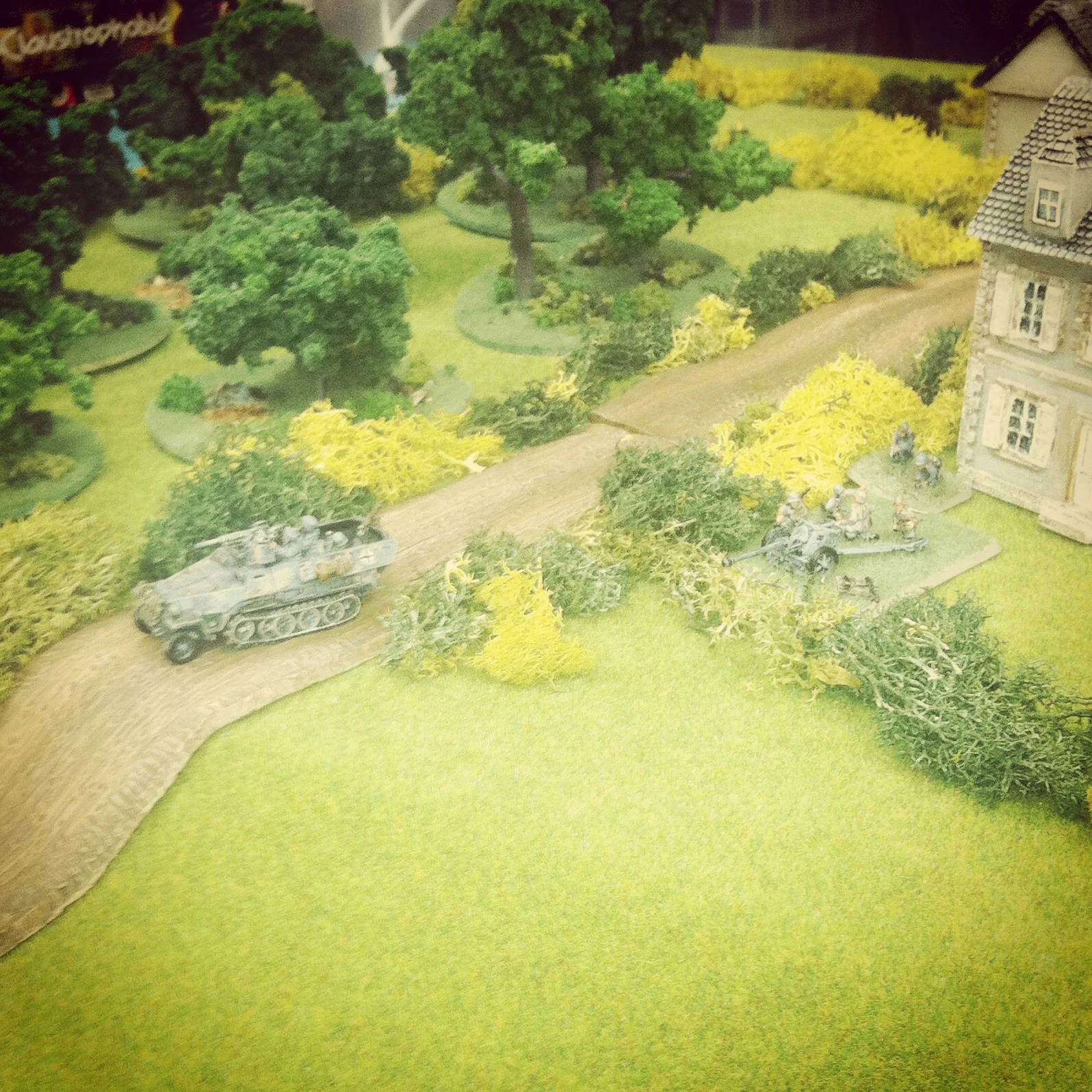 A German Pak 40 and Sdkfz 10/1 break their cover on Hill 91 to engage the paralyzed American column