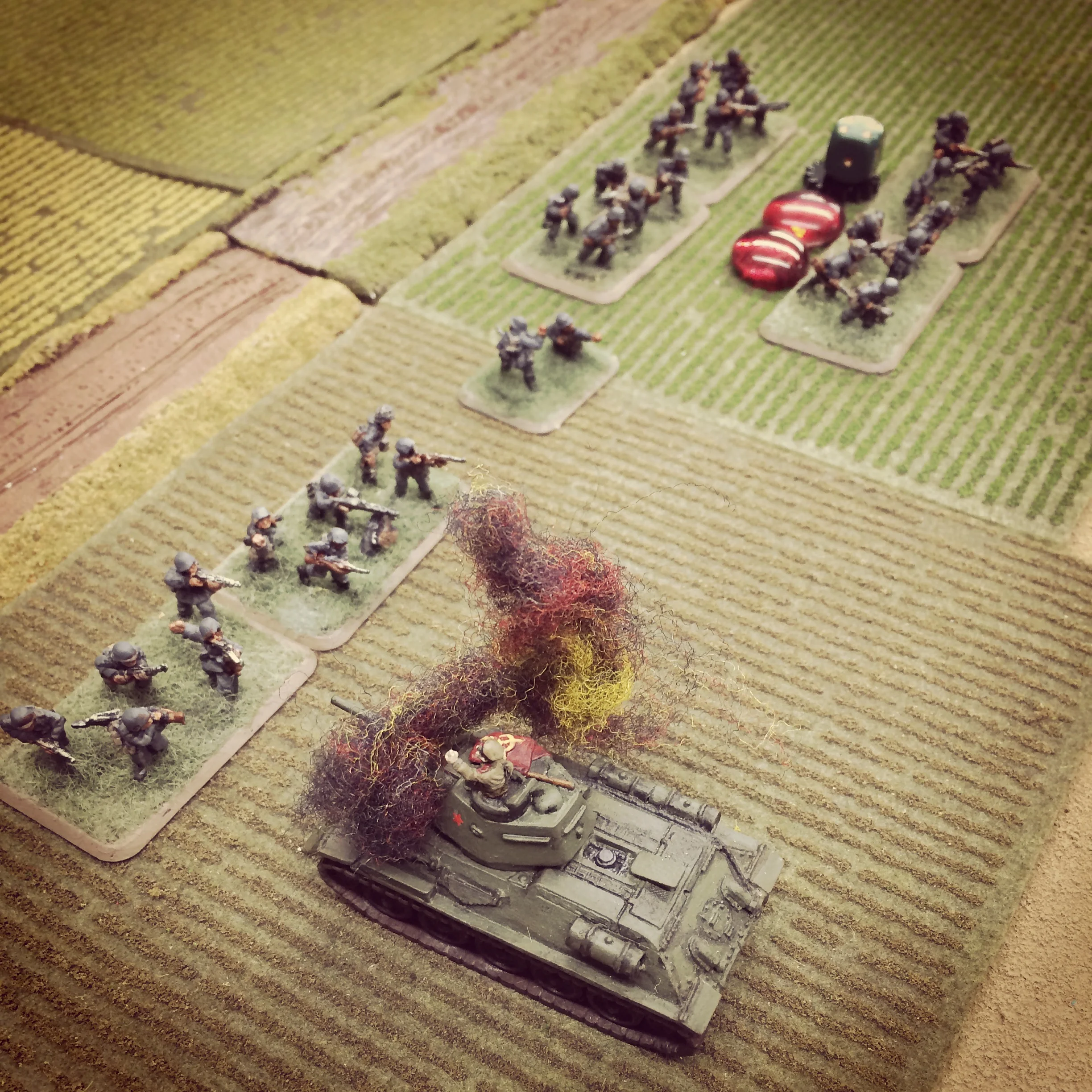 The Soviet commander exposes Germans dug into the field just as his tank is destroyed