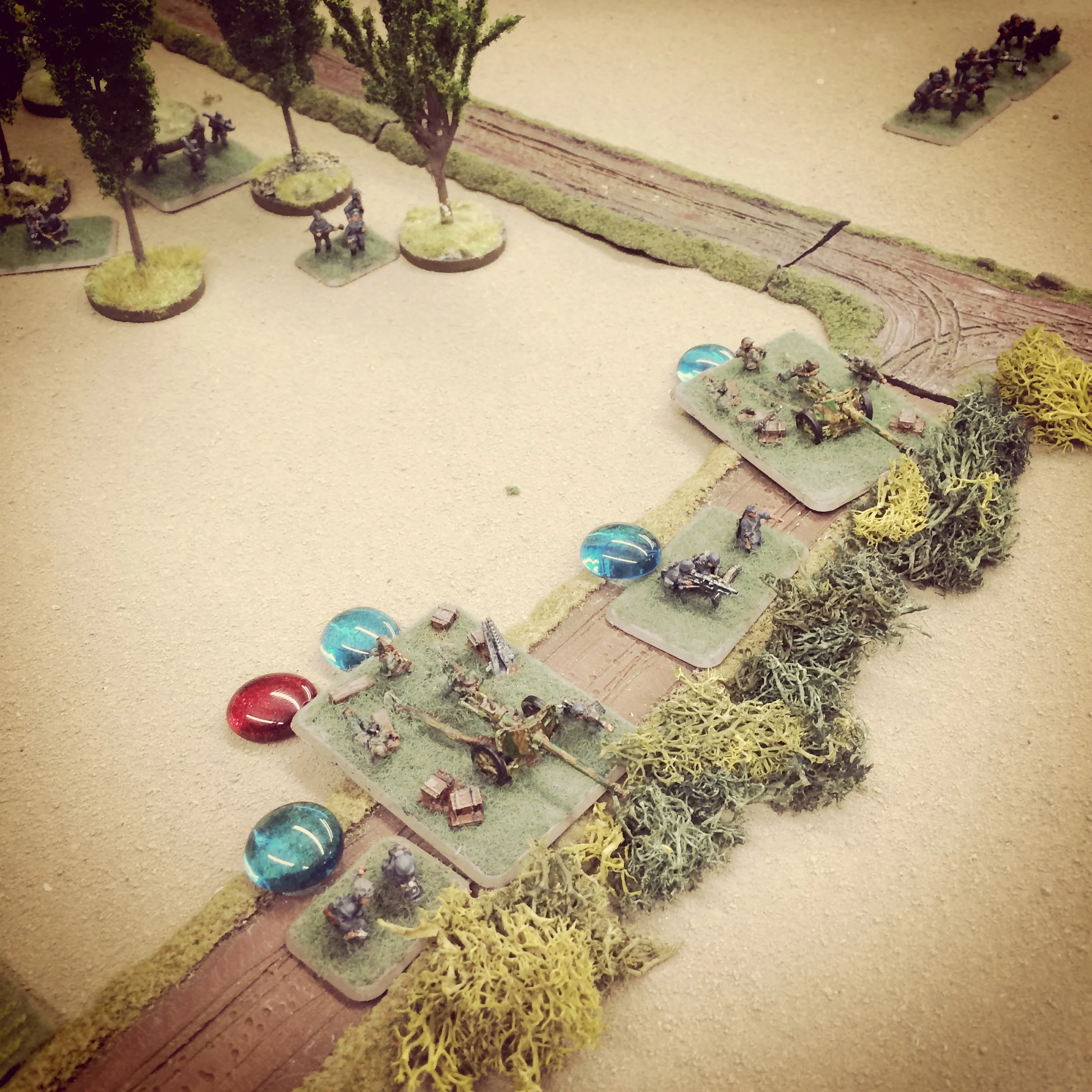 German Pak 40s and MG42s hold the center