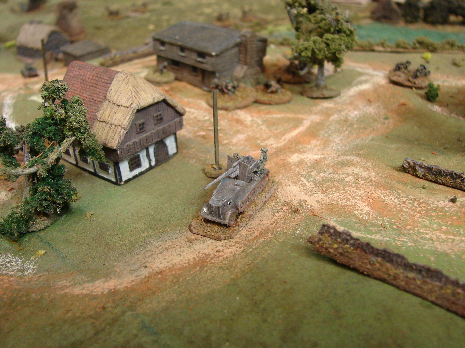 Two 6mm Selbstafahrlafetten or 8.8 cm Flak (sfl) auf Zugkraftwagen12t. (Sdkfz 8) (Its an 88 stuck on the back half of the Sdkfz8 halftrack) made by Shapeways. I added the crew to the model.
