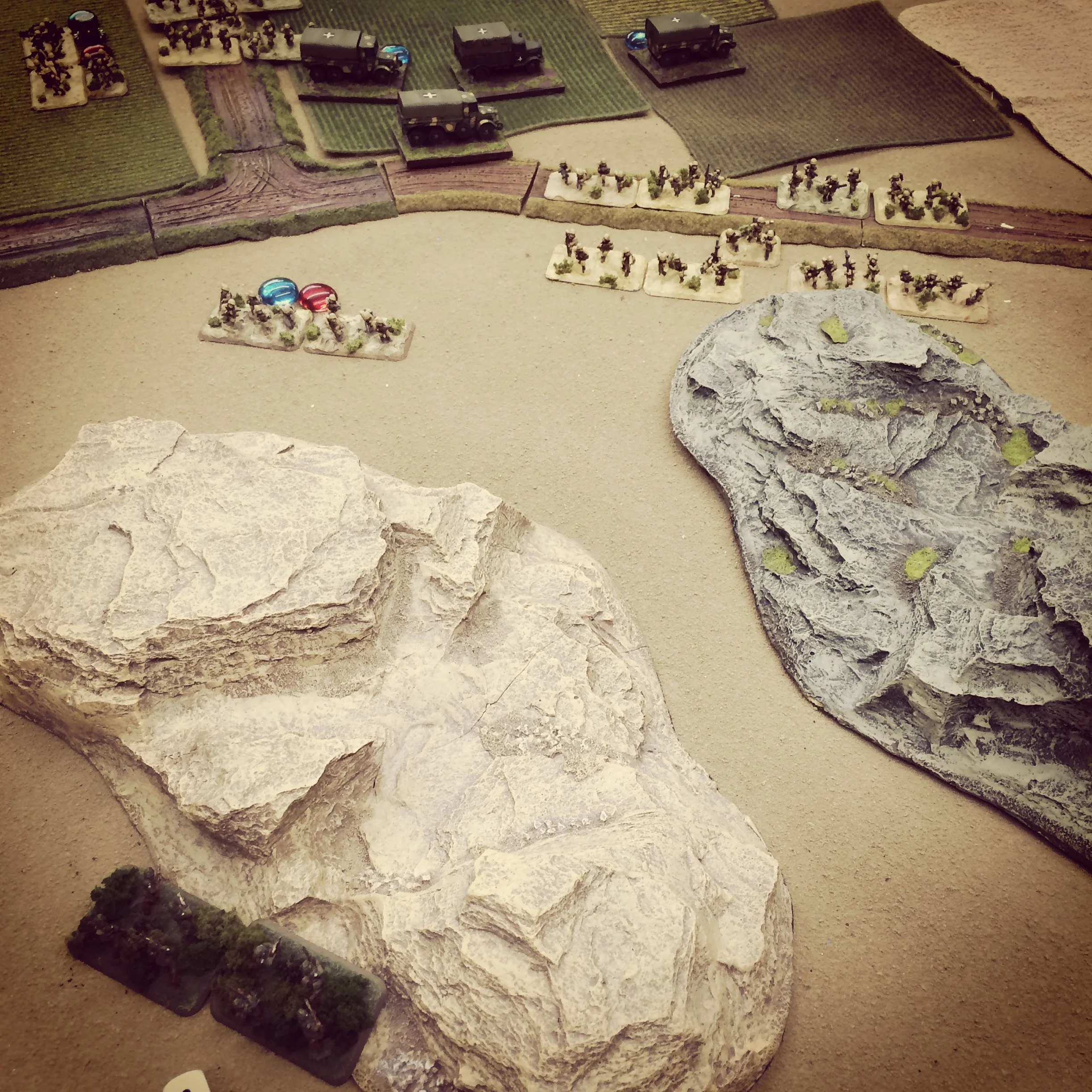 A US recon platoon moves to take position atop a hill as Italians deploy at the crossroads