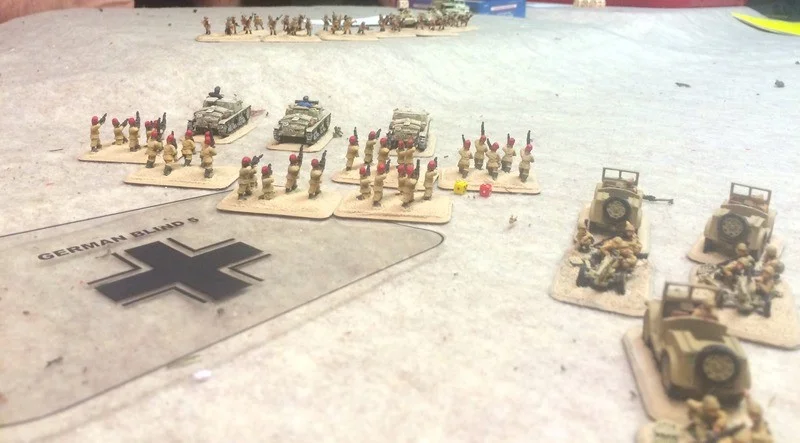 James sends his force at the British centre, unlimbering his AT guns to hold the flank against the British armour we suspect is lurking in the sand dunes.